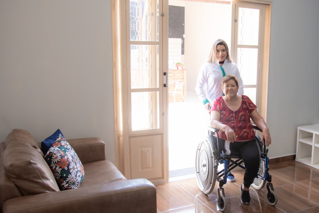 Person in wheelchair inside house